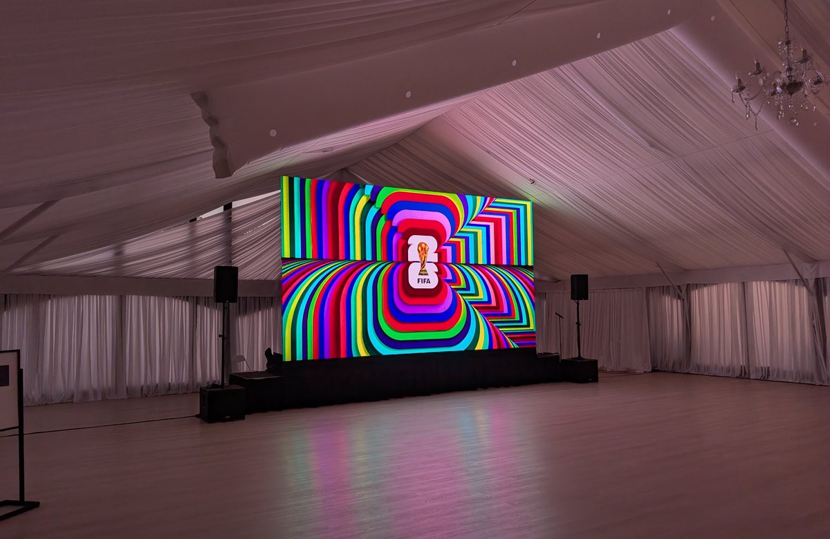 Bright LED wall and playback setup in an event room